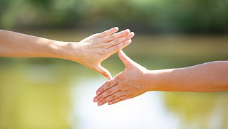 Two hands form a rhombus